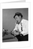 1960s Reporter With Hat On Phone At Typewriter by Anonymous