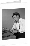 1960s Reporter With Hat On Phone At Typewriter by Anonymous