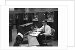 1960s Man In Shirt Tie and Thick Black Glasses Working With IBM Data Processing System by Anonymous