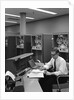 1960s Man In Shirt and Tie and Glasses At Control Console For Ibm Data Processing Systm by Anonymous
