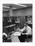 1960s Man In Shirt and Tie and Glasses At Control Console For Ibm Data Processing Systm by Anonymous
