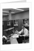 1960s Man In Shirt and Tie and Glasses At Control Console For Ibm Data Processing Systm by Anonymous