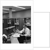 1960s Man In Shirt and Tie and Glasses At Control Console For Ibm Data Processing Systm by Anonymous