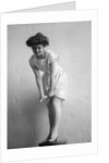 1900s 1910s Woman With Gibson Girl Hair Style Ringing Out Wet Chemise Hemline by Anonymous
