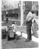 1920s Little Girl Standing Beside Her Pedal Car Asking For Gasoline by Anonymous