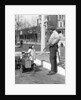 1920s Little Girl Standing Beside Her Pedal Car Asking For Gasoline by Anonymous