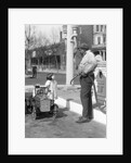 1920s Little Girl Standing Beside Her Pedal Car Asking For Gasoline by Anonymous