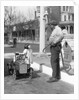 1920s Little Girl Standing Beside Her Pedal Car Asking For Gasoline by Anonymous