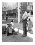 1920s Little Girl Standing Beside Her Pedal Car Asking For Gasoline by Anonymous