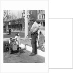 1920s Little Girl Standing Beside Her Pedal Car Asking For Gasoline by Anonymous