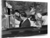 1950s Family Father Mother Daughter Son In Convertible Reading Map by Anonymous
