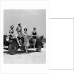 1920s 1930s Four Women In Dresses And Bathing Suits Gathered Around Convertible Touring Car At Seashore by Anonymous