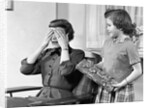 1950s Woman Mother Hands Covering Eyes As Girl Daughter Gives Her A Gift Present by Anonymous