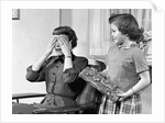 1950s Woman Mother Hands Covering Eyes As Girl Daughter Gives Her A Gift Present by Anonymous