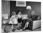 1950s Little Boy And Girl Son And Daughter Giving Woman Mother Sitting In Living Room A Gift Present by Anonymous