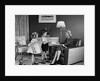 1950s Little Boy And Girl Son And Daughter Giving Woman Mother Sitting In Living Room A Gift Present by Anonymous