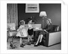 1950s Little Boy And Girl Son And Daughter Giving Woman Mother Sitting In Living Room A Gift Present by Anonymous