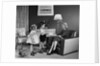 1950s Little Boy And Girl Son And Daughter Giving Woman Mother Sitting In Living Room A Gift Present by Anonymous