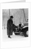 1930s Man In Hat And Raccoon Fur Coat Standing Foot On Bumper Of Chevrolet Roadster Stalled In Snow Storm by Anonymous