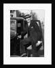 1930s Man In Suit And Hat Holding Gloves Stepping Into Automobile Driver Seat by Anonymous
