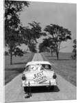 1950s Back Of White Ford Sedan Driving Off With Just Married Sign by Anonymous