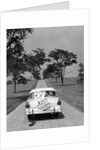 1950s Back Of White Ford Sedan Driving Off With Just Married Sign by Anonymous