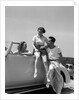 1930s Friends Sitting With Convertible Roadster Automobile Talking Together At Seashore by Anonymous