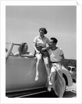1930s Friends Sitting With Convertible Roadster Automobile Talking Together At Seashore by Anonymous