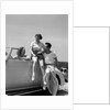 1930s Friends Sitting With Convertible Roadster Automobile Talking Together At Seashore by Anonymous