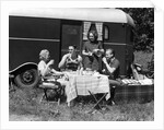 1930s Two Couples Eating Picnic Lunch Beside Camping Trailer by Anonymous