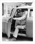 1950s Man Holding Car Door Open by Anonymous