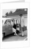1950s Man Opening Automobile Door For Woman by Anonymous