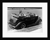 1940s Family Of Four In Convertible Ford V-8 Sedan At Camera by Anonymous