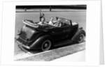 1940s Family Of Four In Convertible Ford V-8 Sedan At Camera by Anonymous