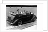 1940s Family Of Four In Convertible Ford V-8 Sedan At Camera by Anonymous