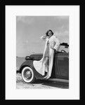 1930s 1940s Woman Wearing Chenille Beach Robe Posing On Running Board Of Convertible Roadster Automobile by Anonymous
