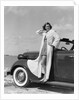 1930s 1940s Woman Wearing Chenille Beach Robe Posing On Running Board Of Convertible Roadster Automobile by Anonymous