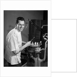 1960s Portrait Man Professional Dentist Holding Dental Tool Mirror by Anonymous