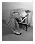1960s Little Girl Turning On Television Set by Anonymous