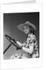 1930s 1940s Woman Wearing Straw Hat Sun Dress Driving Gloves Holding Auto Mobile Steering Wheel Looking At Camera by Anonymous