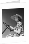 1930s 1940s Woman Wearing Straw Hat Sun Dress Driving Gloves Holding Auto Mobile Steering Wheel Looking At Camera by Anonymous