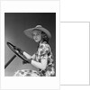 1930s 1940s Woman Wearing Straw Hat Sun Dress Driving Gloves Holding Auto Mobile Steering Wheel Looking At Camera by Anonymous
