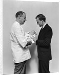 1930s 1940s Man Doctor Showing New Born Infant Baby To Proud Father by Anonymous