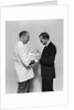 1930s 1940s Man Doctor Showing New Born Infant Baby To Proud Father by Anonymous