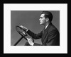 1930s 1940s Man Wearing Suit And Tie Holding Automobile Steering Wheel by Anonymous