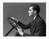 1930s 1940s Man Wearing Suit And Tie Holding Automobile Steering Wheel by Anonymous