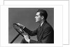 1930s 1940s Man Wearing Suit And Tie Holding Automobile Steering Wheel by Anonymous