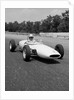 1960s Lotus Ford Race Car Speeding Around Track by Anonymous