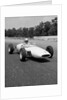 1960s Lotus Ford Race Car Speeding Around Track by Anonymous