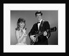 1960s Teenage Entertainment Duo Man Playing Guitar And Woman Singing Holding Microphone by Anonymous